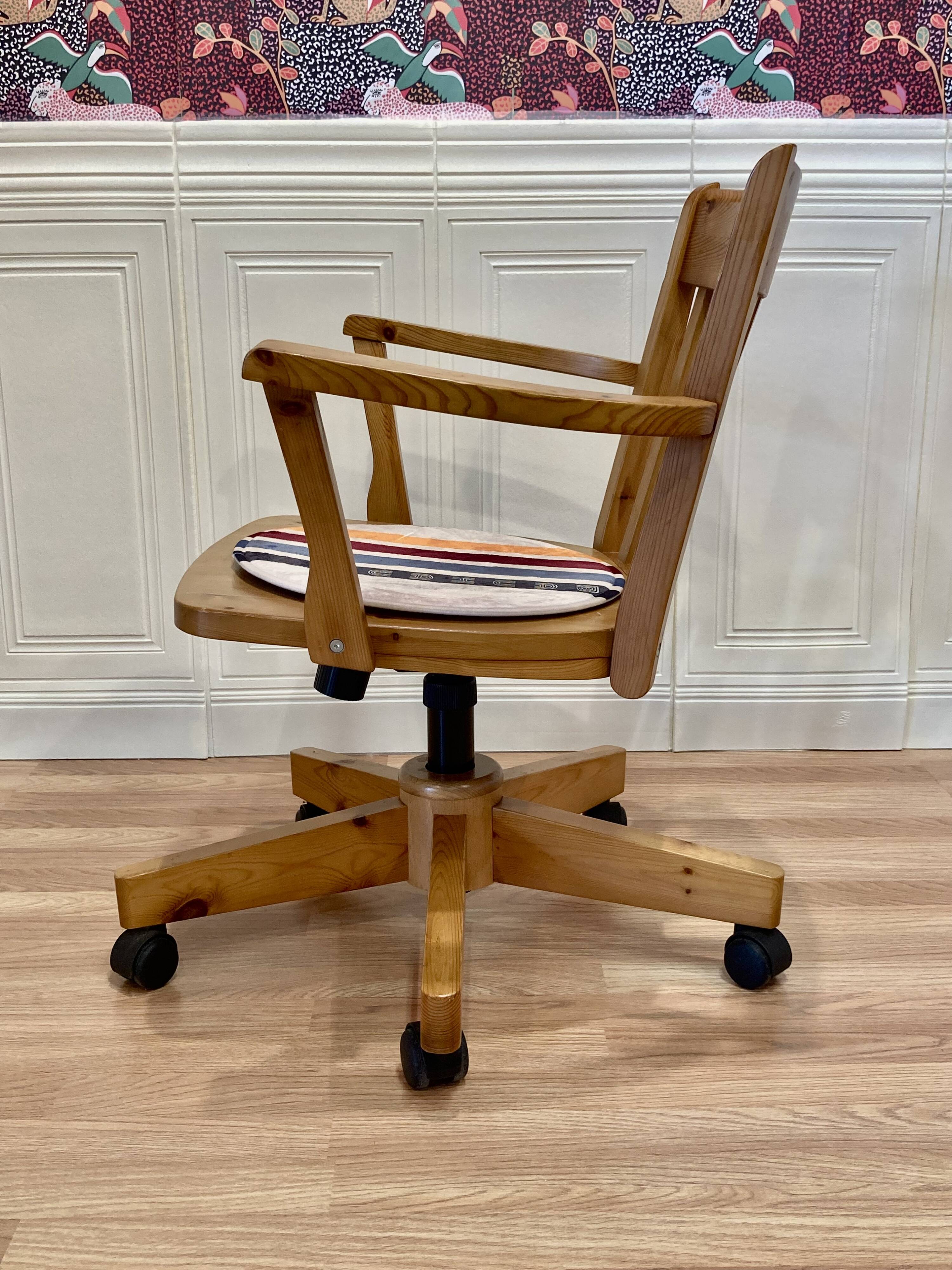 Solid wood swivel and reclining armchair.