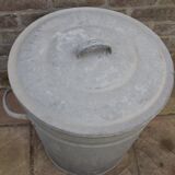 Old galvanized zinc trash can with lid