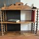 Antique wall shelf made of turned wood and spools of thread, late 19th century.