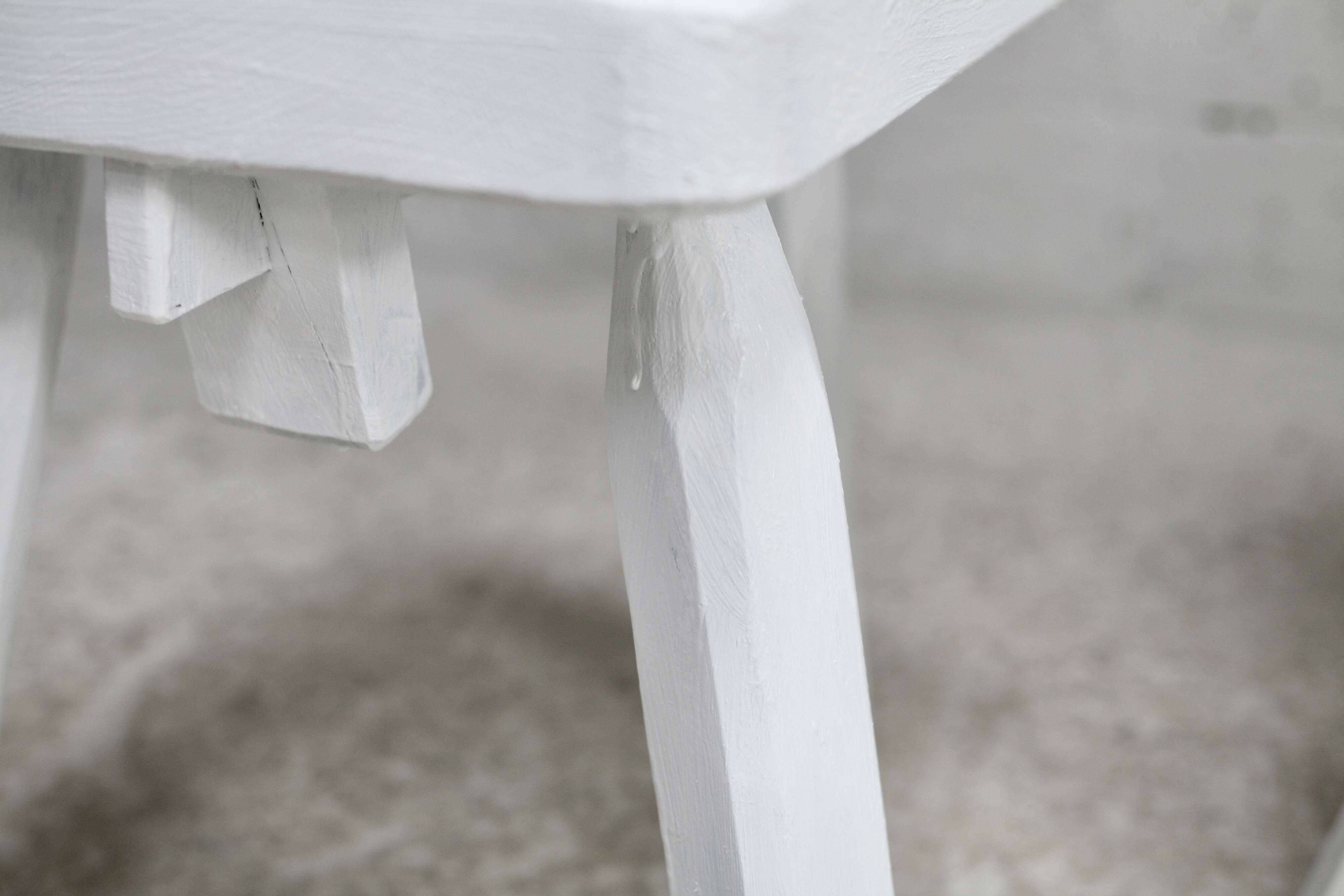 Pair of tripod chairs, gouged seats. Brutalist, circa 1960. Painted wood.