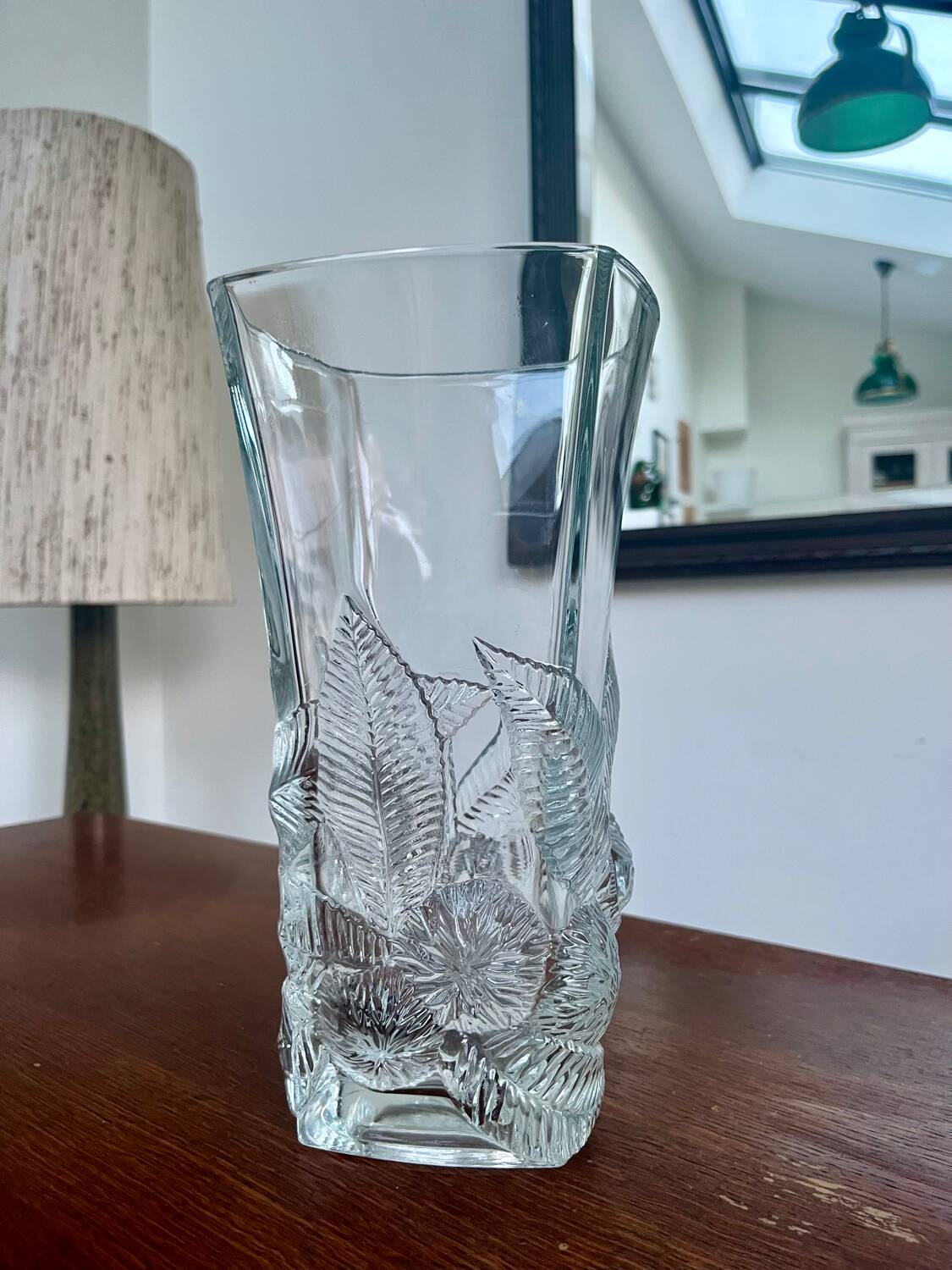 Large moulded glass vase with a floral design