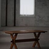 Solid oak dining table with cross base by Danish cabinetmaker, mid-20th century.