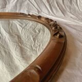 Antique oval beveled mirror in carved wood - 69 cm