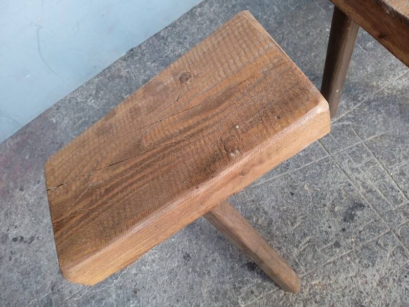 Pair of low stools in old patinated solid wood