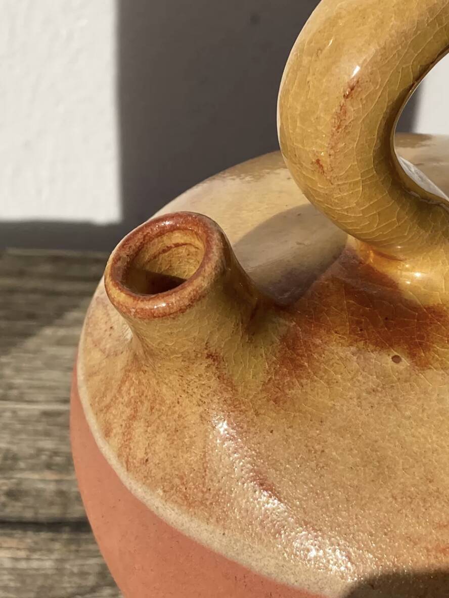 Gargoulette or old jug in yellow glazed terracotta