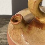 Gargoulette or old jug in yellow glazed terracotta