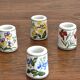 Set of 9 mini vintage porcelain candle holders decorated with spring flowers.