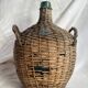 Vintage Spanish wicker demijohn bottle