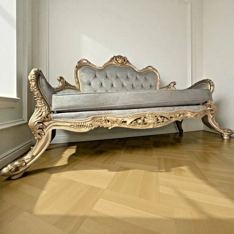 A soft light blue and silver tufted beech wood sofa in Louis style.