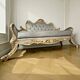 A soft light blue and silver tufted beech wood sofa in Louis style.