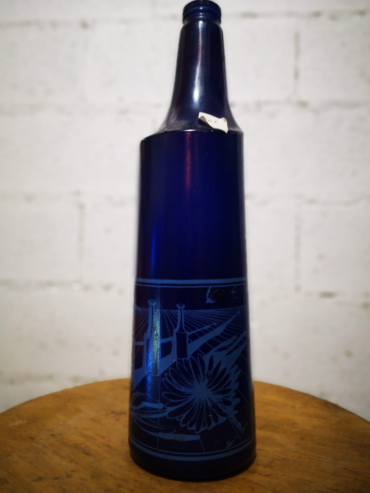 Surreal blue glass bottle, designed by Salvador Dali