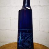 Surreal blue glass bottle, designed by Salvador Dali