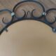 Miroir en fer forgé et bagues métal doré vers 1950 - 39cm
