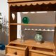Wall shelf in raw wood with drawers and openwork hearts