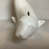 White earthenware sea lion in piggy bank
