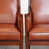 Majestic, luxurious set of 4 cognac-colored cowhide leather Art Deco design armchairs