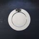 Vintage silver-plated round service tray with embossed cherries.