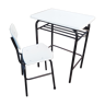 Schoolboy style desk with its white adult size chair