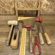 lot of antique toys, carpentry tools, wood, saw, plane, hammer,...