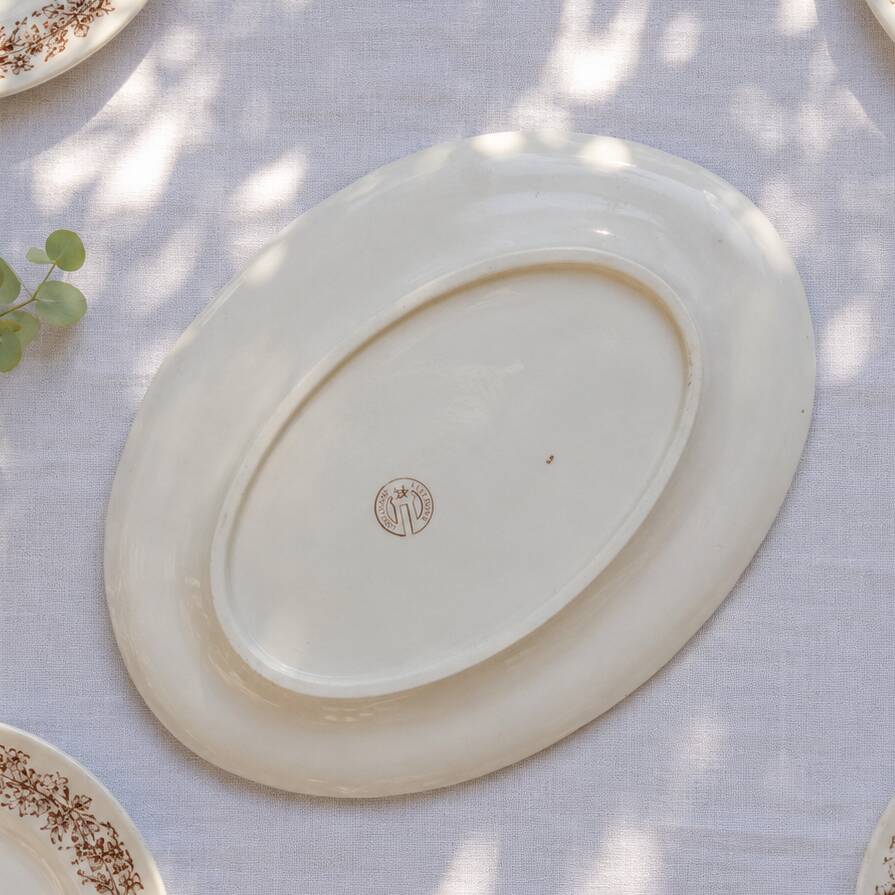 Oval dish from the 19th century in ironstone signed Longchamp "Liserons"