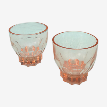 Two pink glass glasses