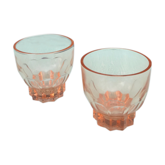 Two pink glass glasses