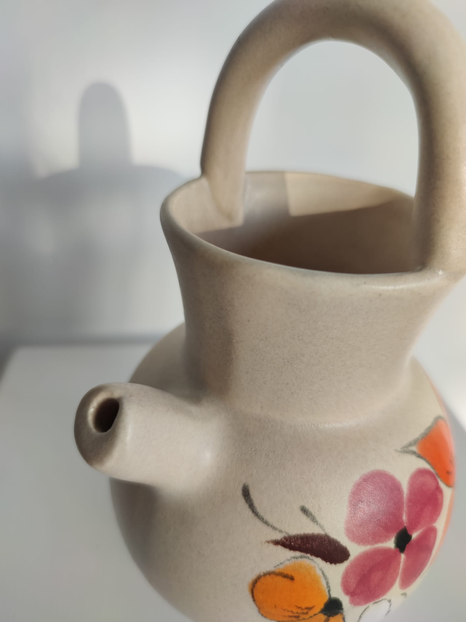 Pitcher ball in sandstone with floral pattern