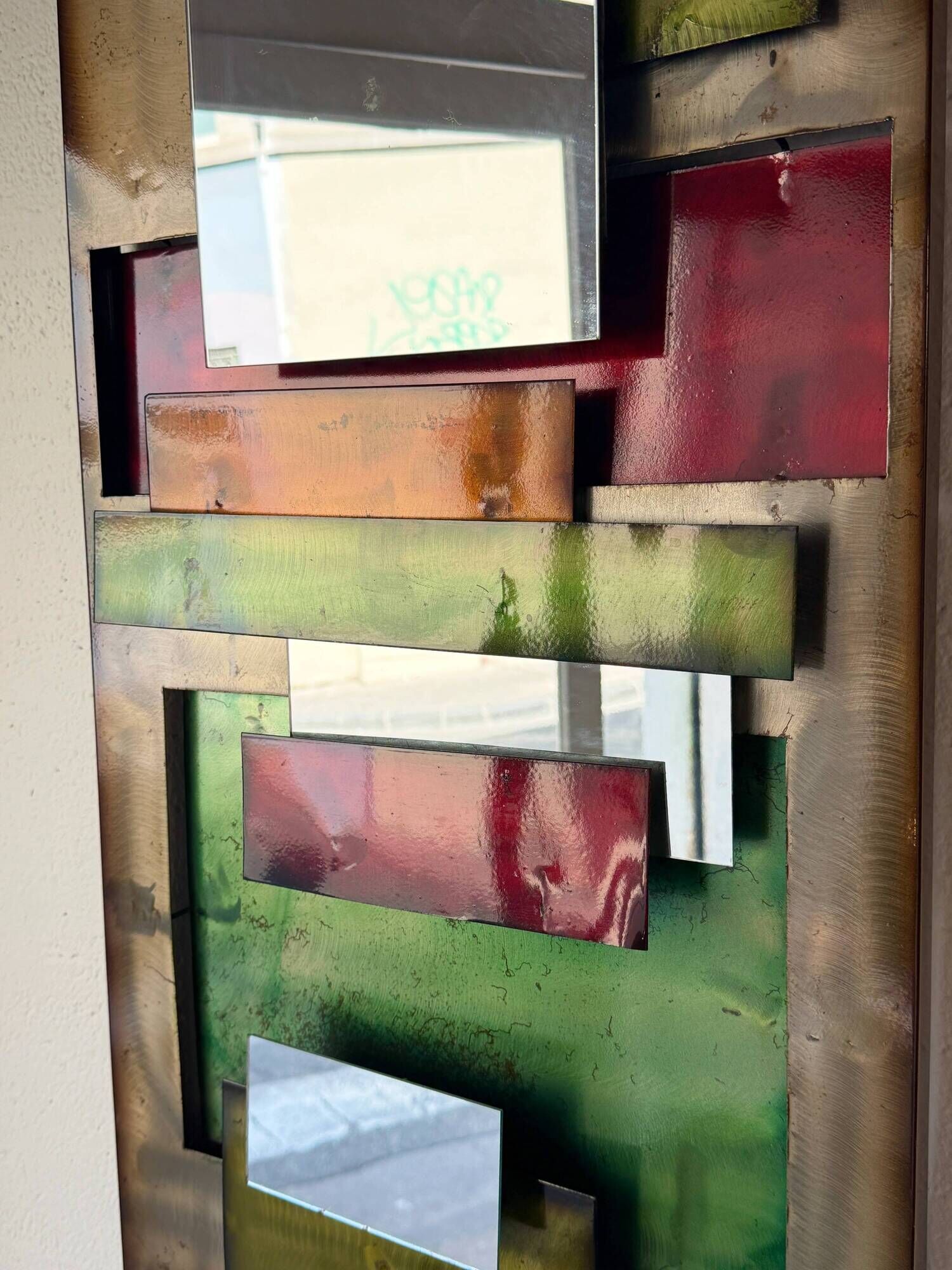 Large metal "polychrome" mirror — 1970s