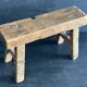 Ancient Chinese farm bench in patinated wood, small rustic stool.