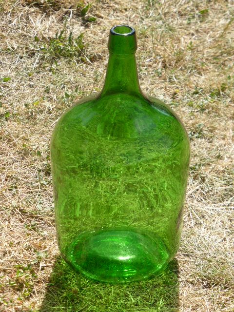 Dark green glass demijohn, vintage