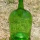 Dark green glass demijohn, vintage