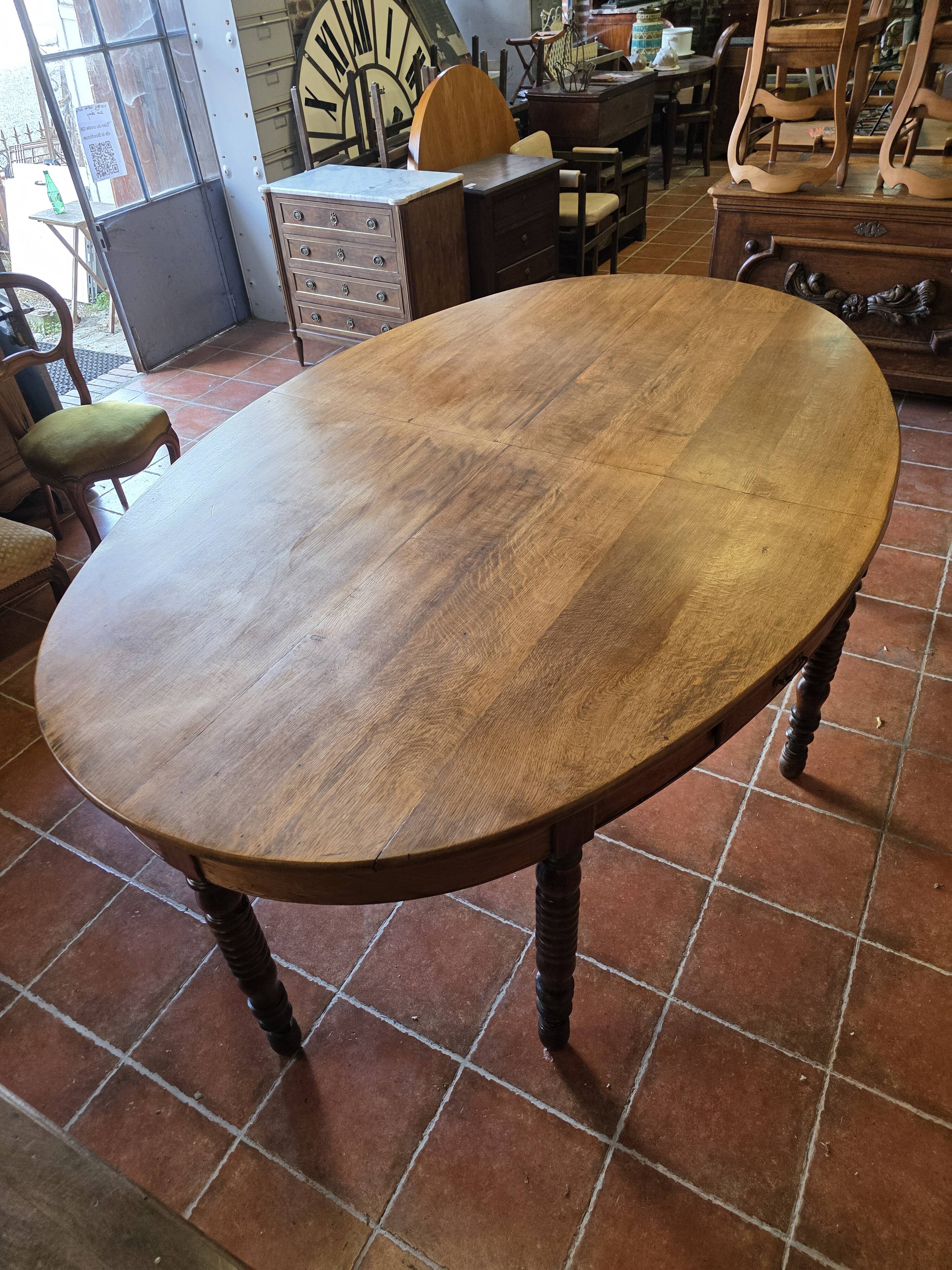 Large oval farmhouse table in solid oak, 19th century, 243 × 153cm