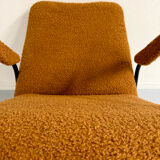 Vintage orange boucle armchair, French design from the 1950s.