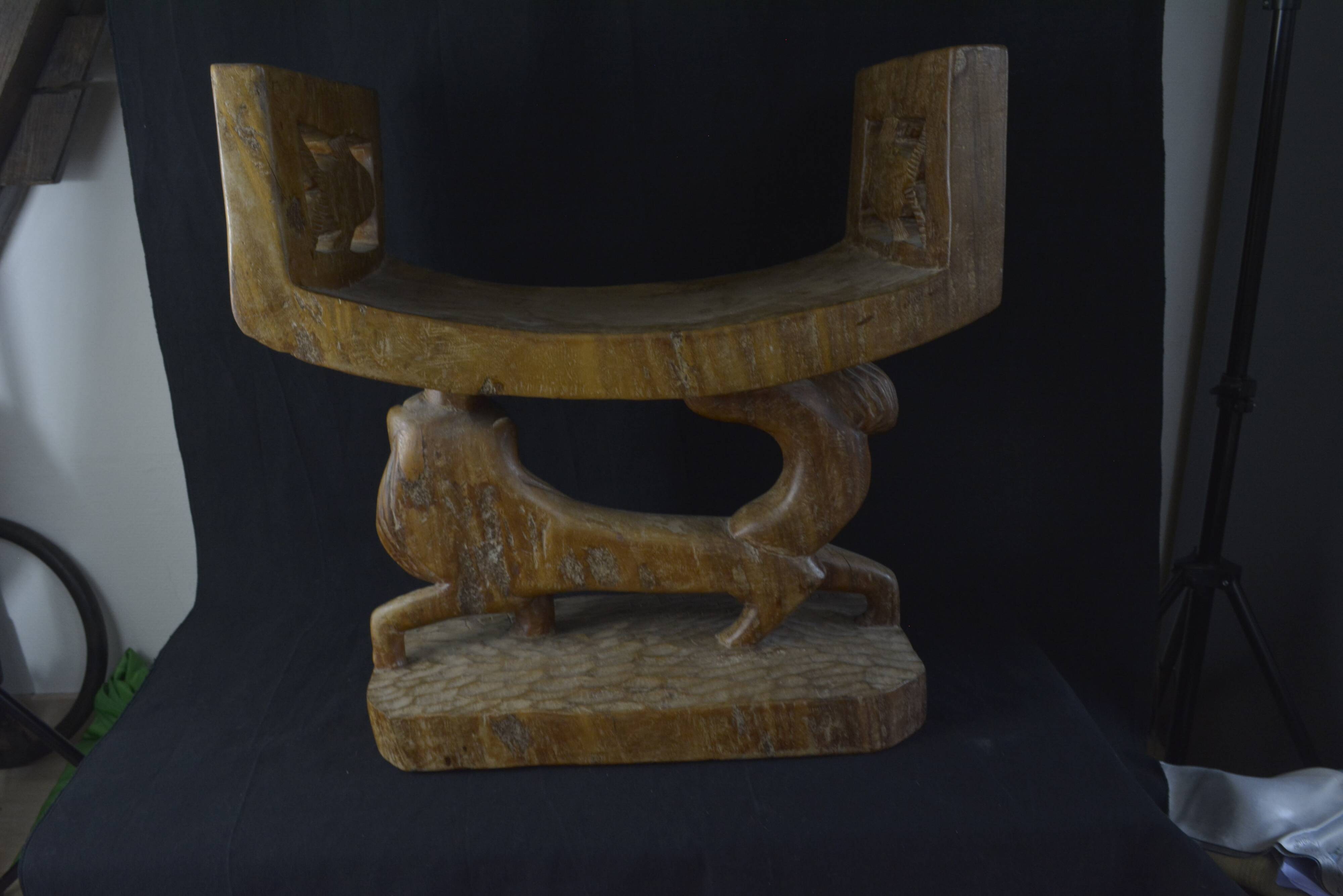 Togolese ethnic stool in carved exotic wood.
