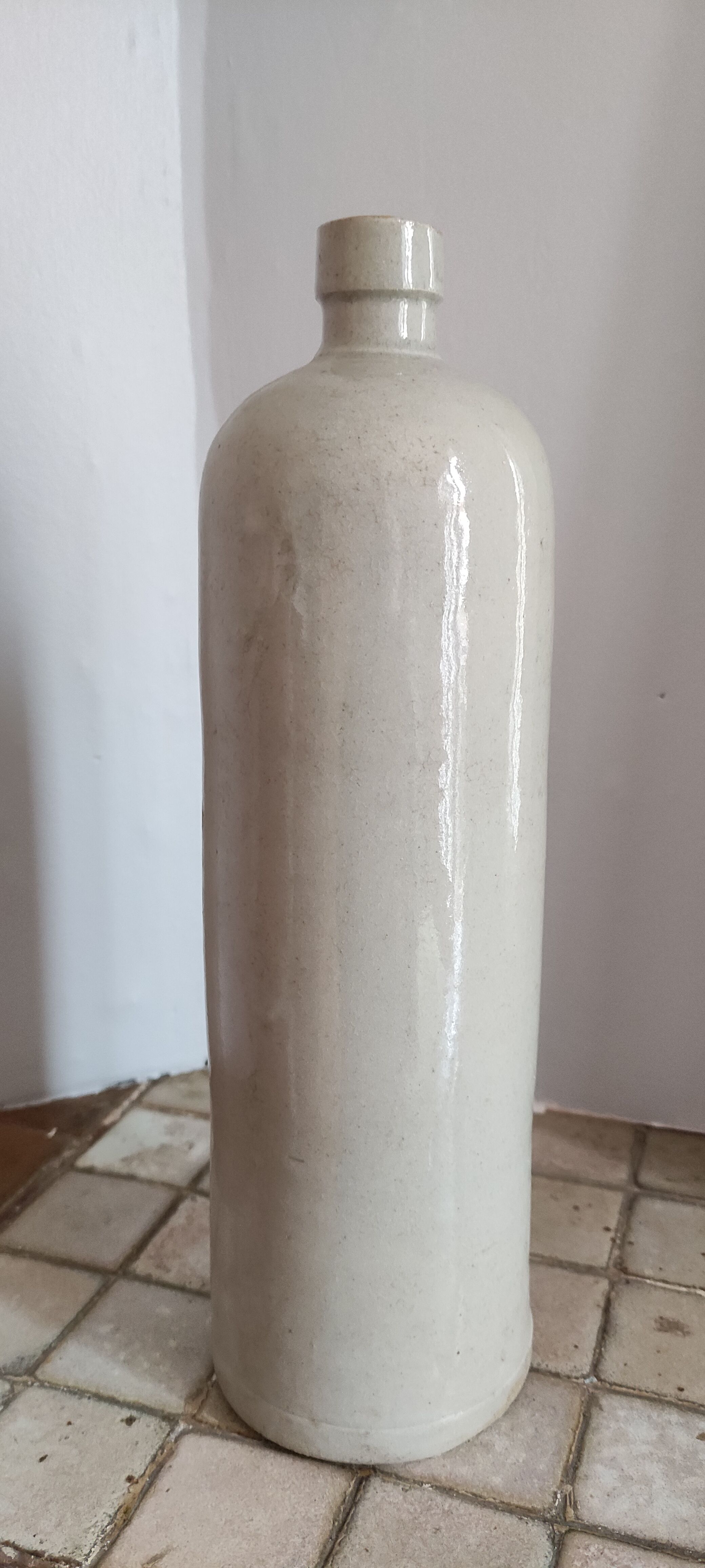 Old bottle in sandstone
