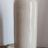 Old bottle in sandstone