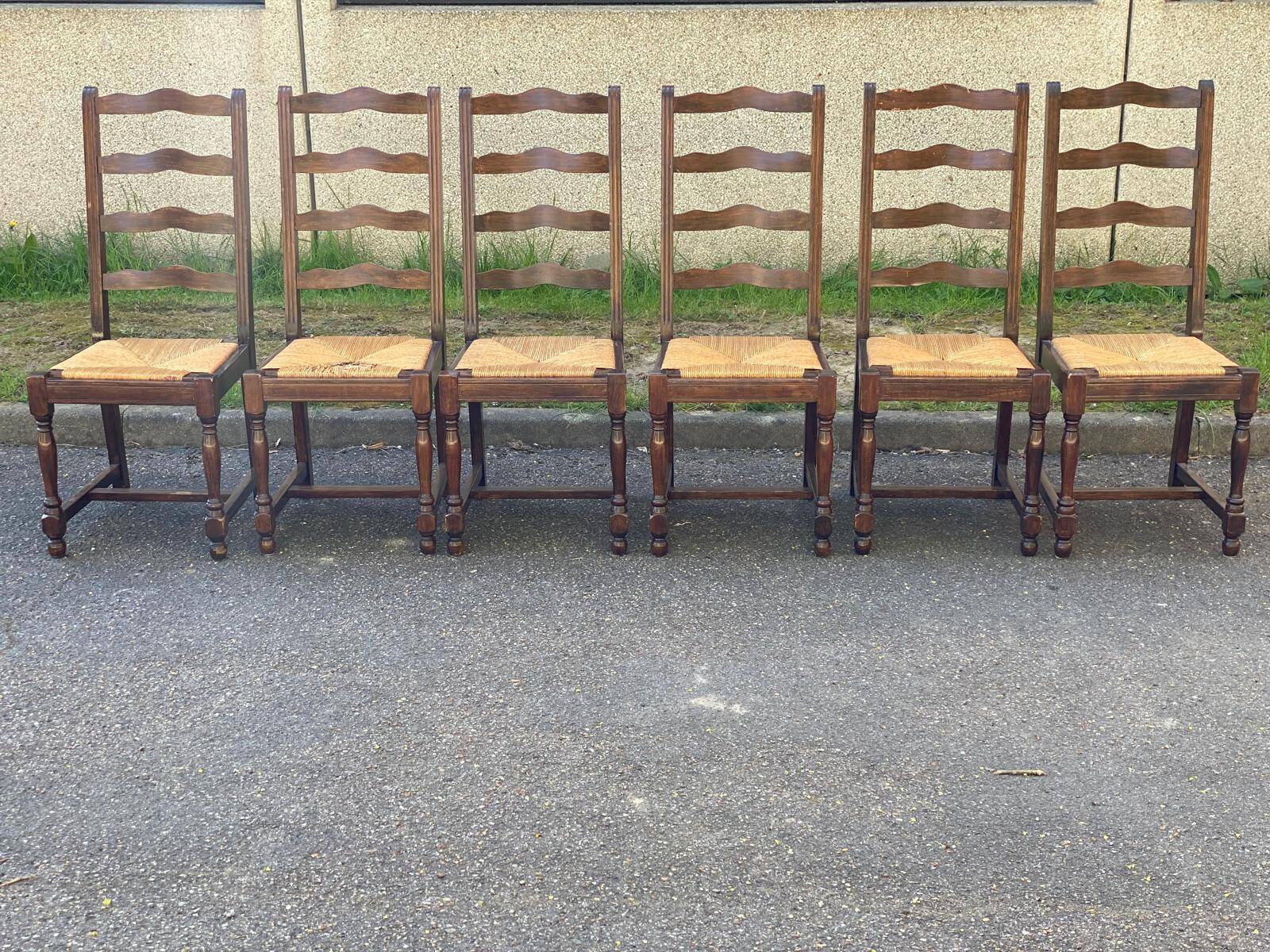 6 solid wood chairs in dark oak with a glossy finish and straw.