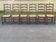 6 solid wood chairs in dark oak with a glossy finish and straw.