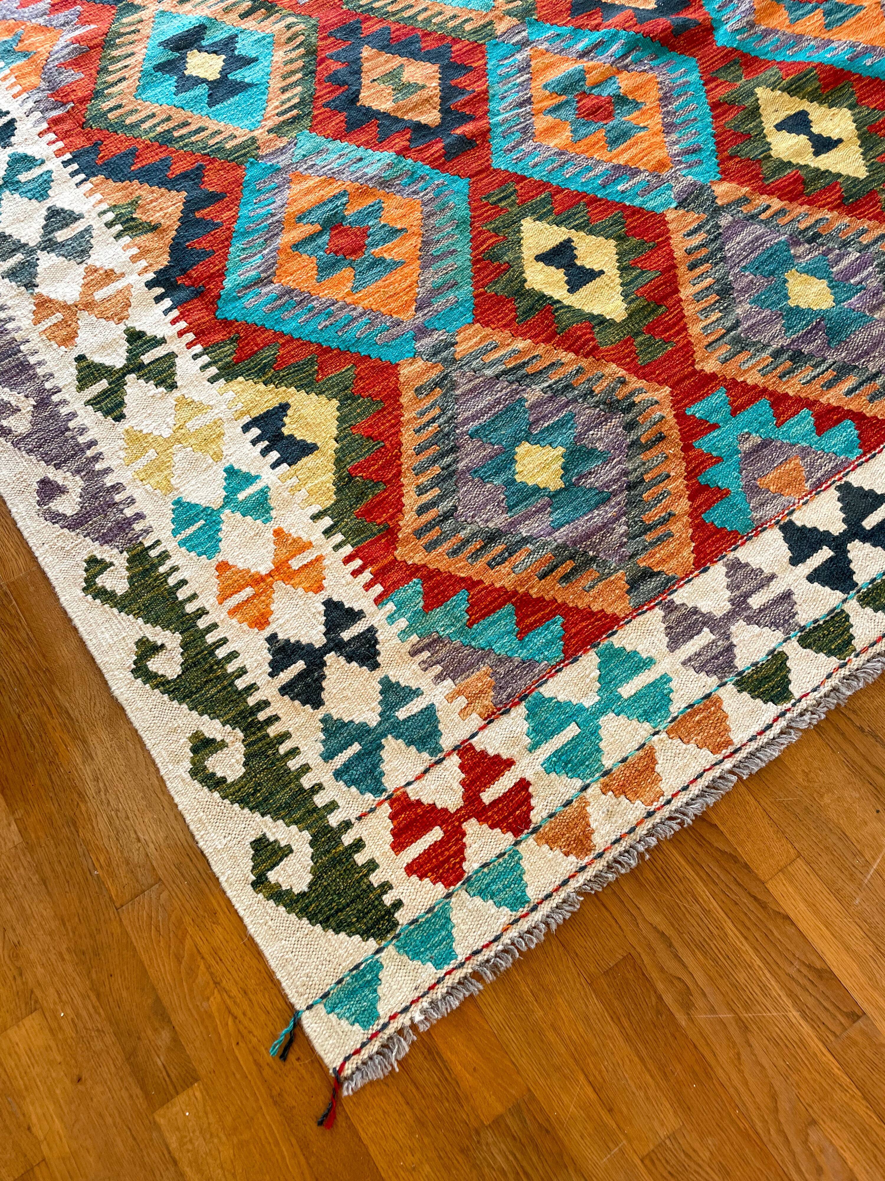 Oriental kilim rug afghan colored red and multicolored