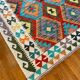 Oriental kilim rug afghan colored red and multicolored