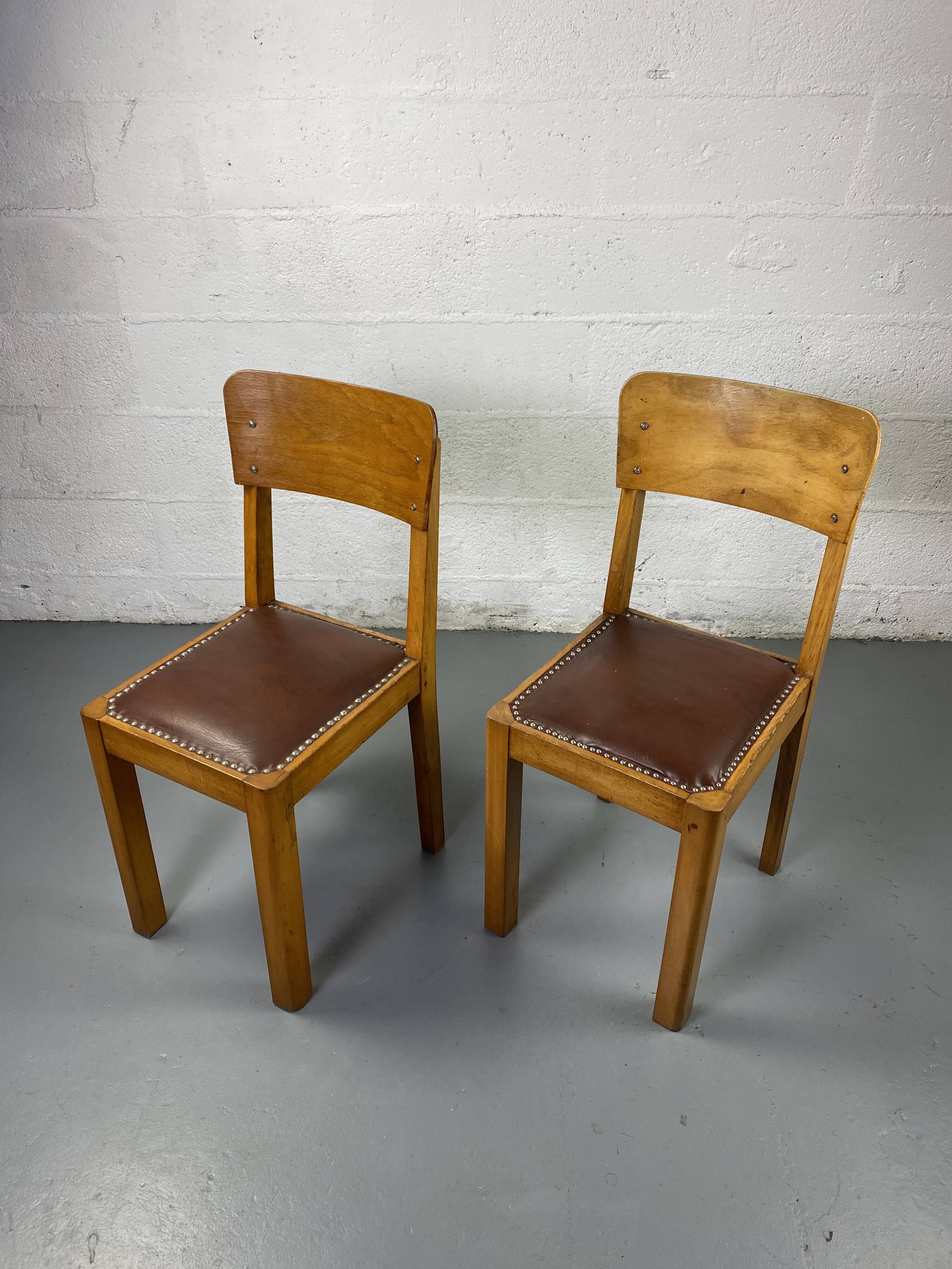 Pair of wooden and leather chairs