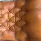 Rocking chair en cuir orange clouté Chesterfield