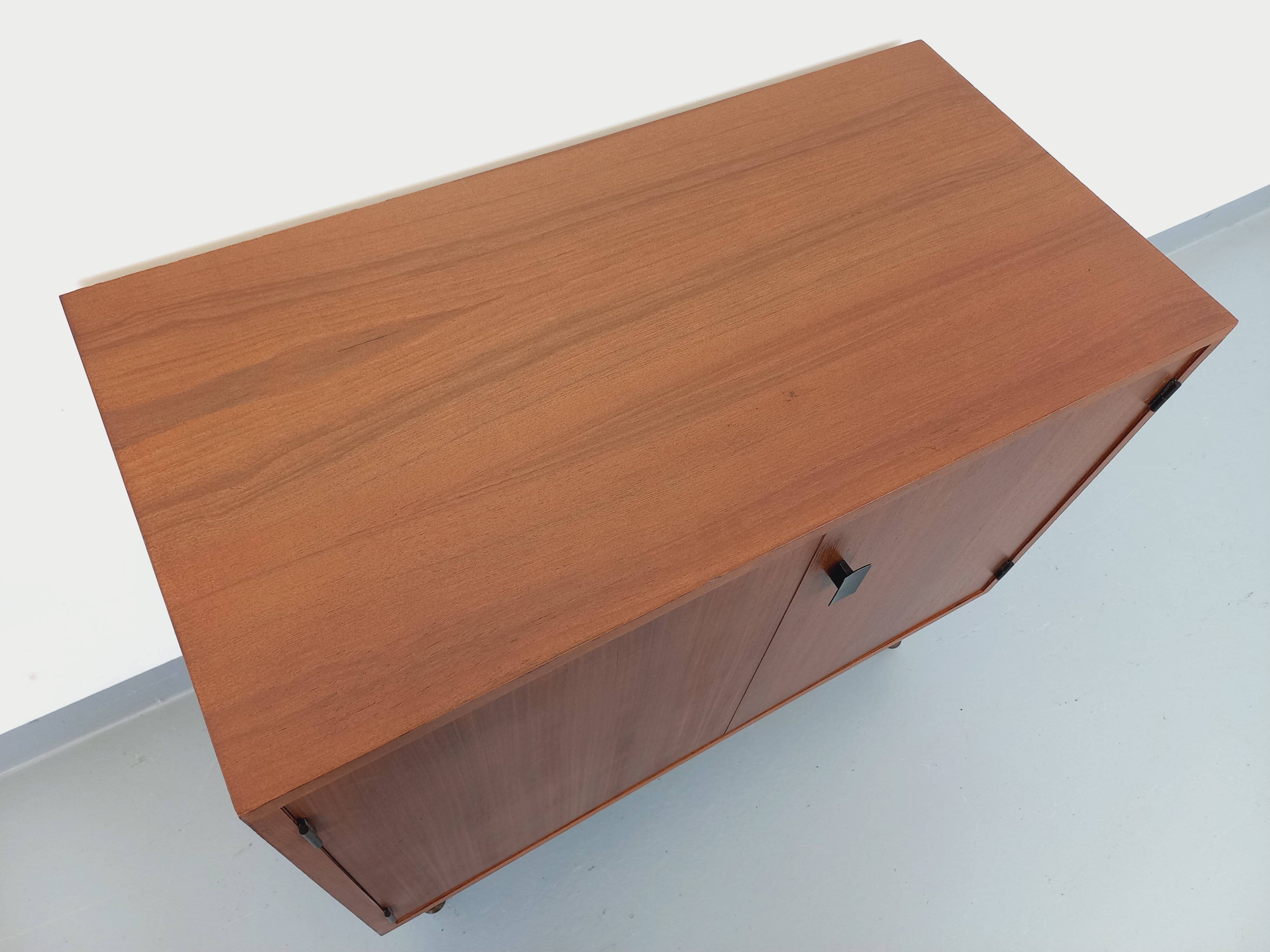 Small vintage storage unit in modernist Scandinavian style in teak from the 60s