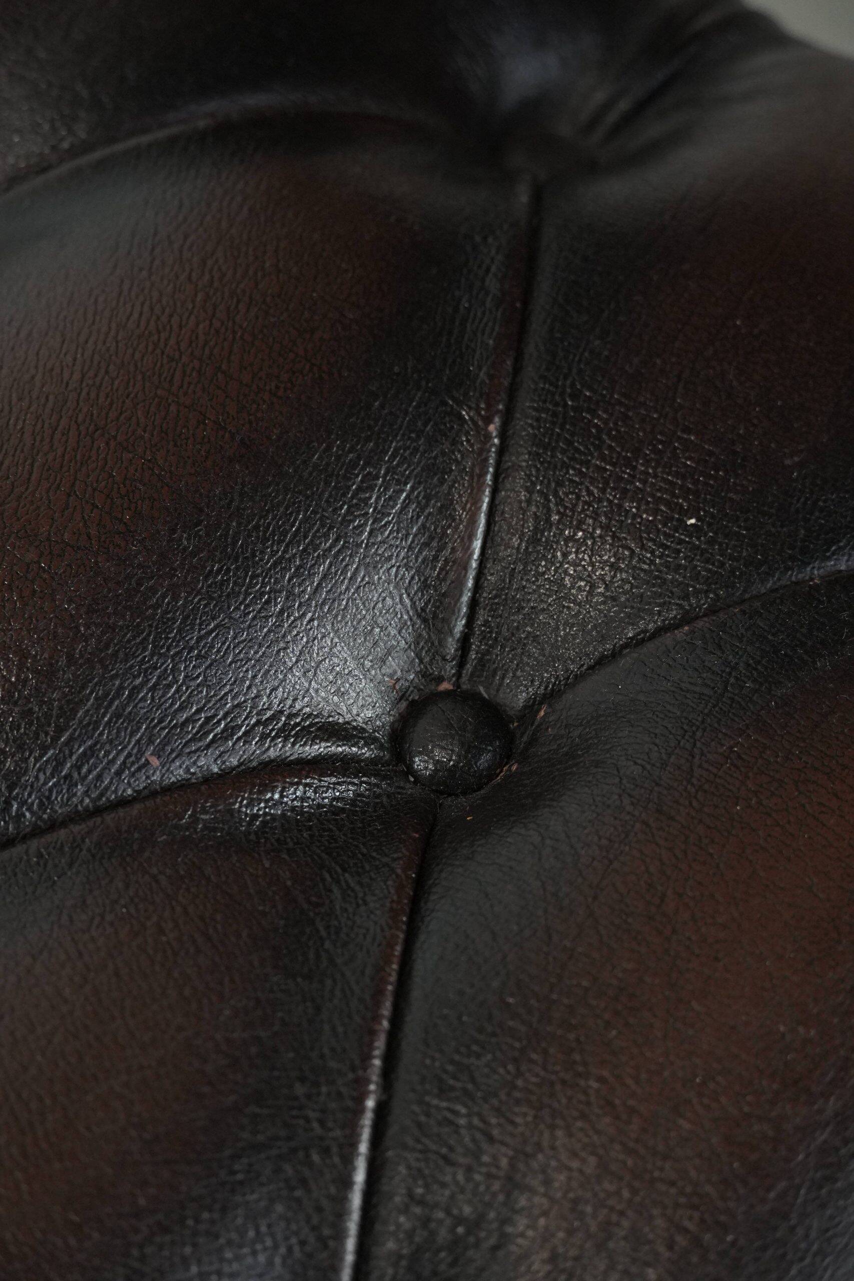 Chesterfield office chair in English style made of cow leather and wood.