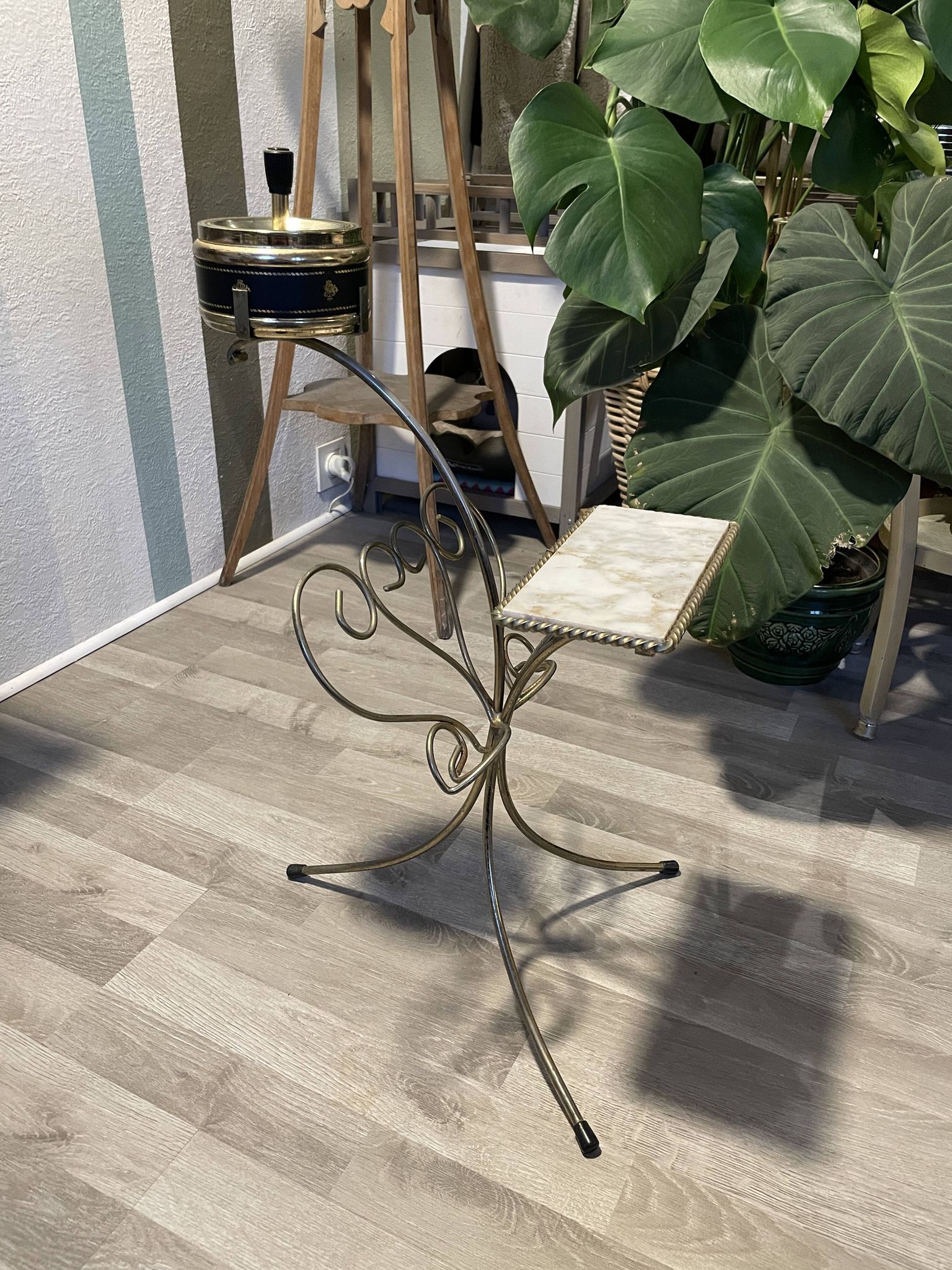 Gold wrought iron ashtray on legs with magazine rack and marbled shelf