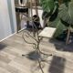 Gold wrought iron ashtray on legs with magazine rack and marbled shelf