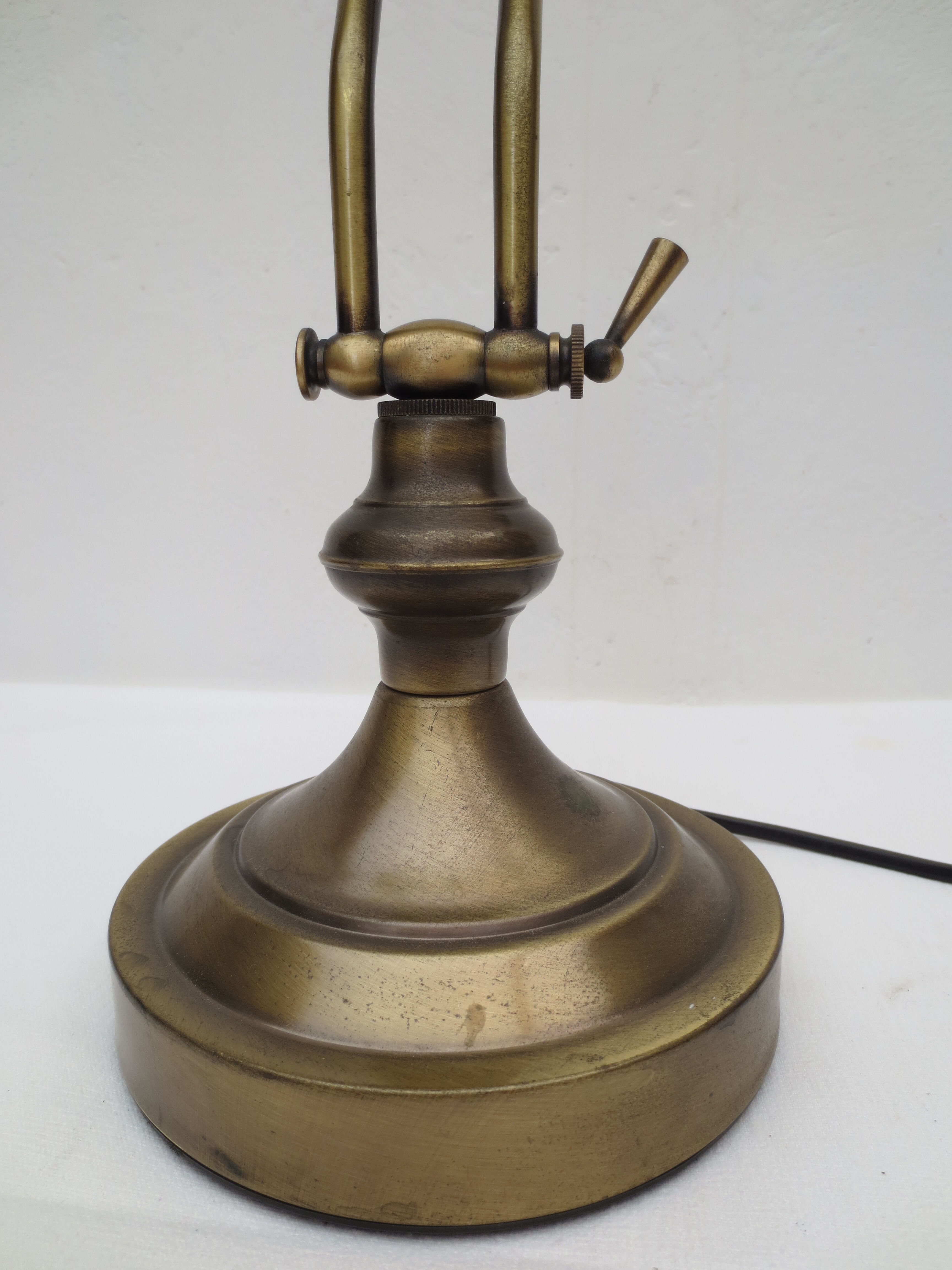 Old aged brass articulated desk lamp