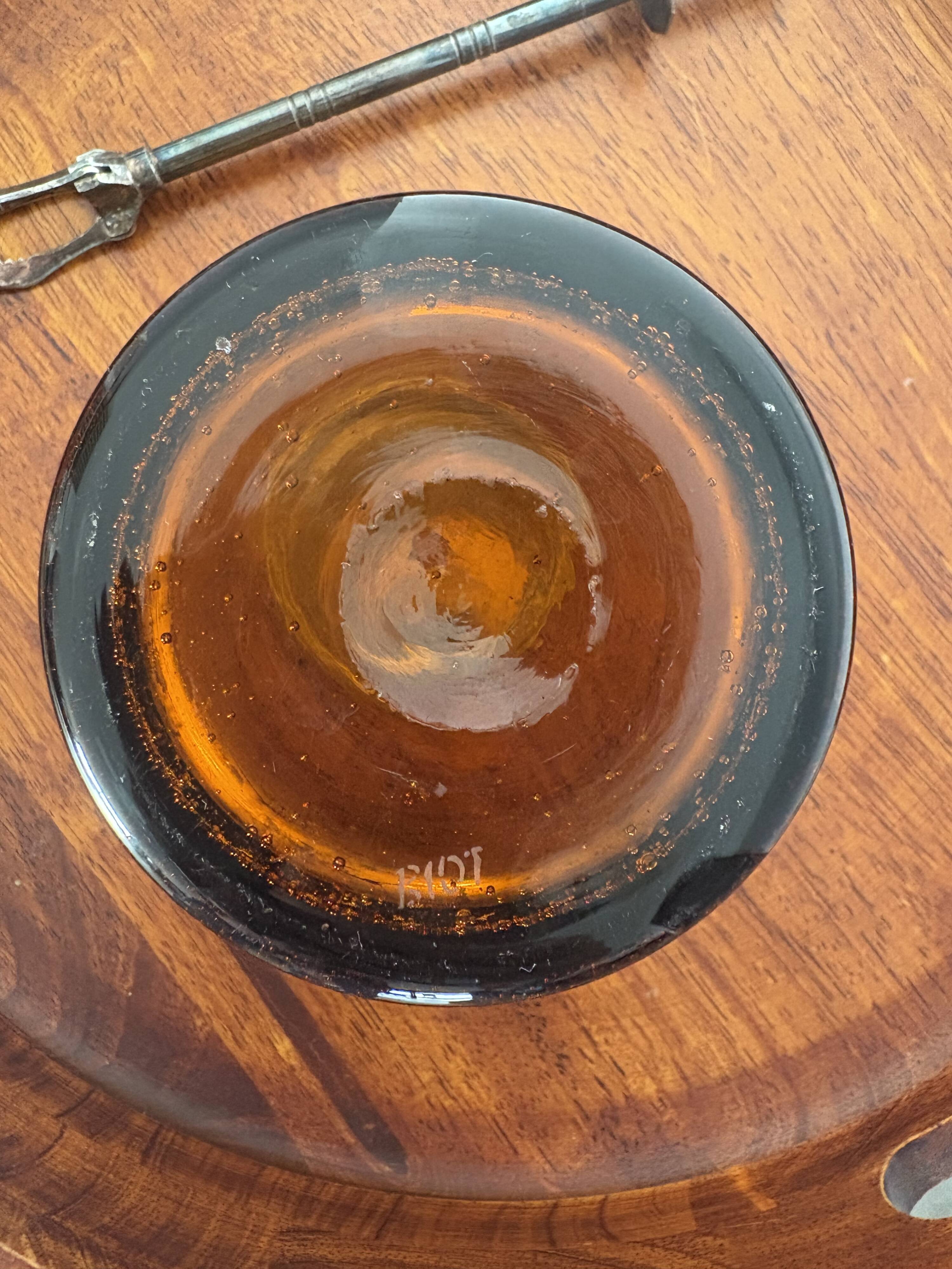 Amber bubble glass ice bucket signed Biot, with its tongs.