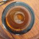 Amber bubble glass ice bucket signed Biot, with its tongs.