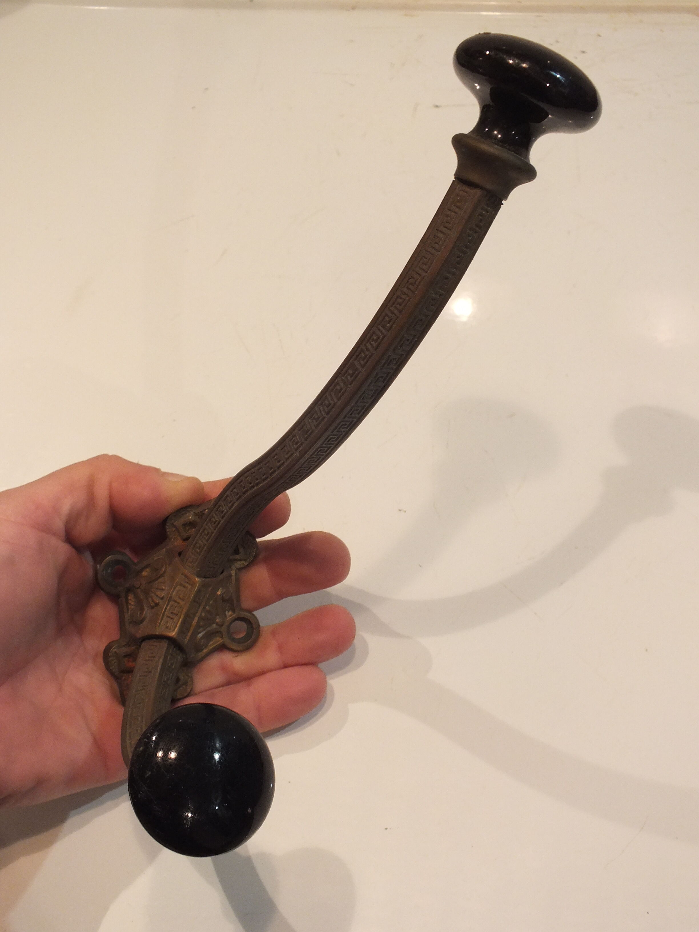 Old large hook Napoleon III in brass and earthenware